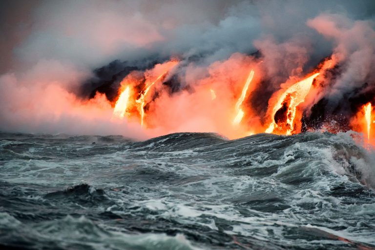 Molten lava flowing into the Pacific Ocean on Big Island of Hawa