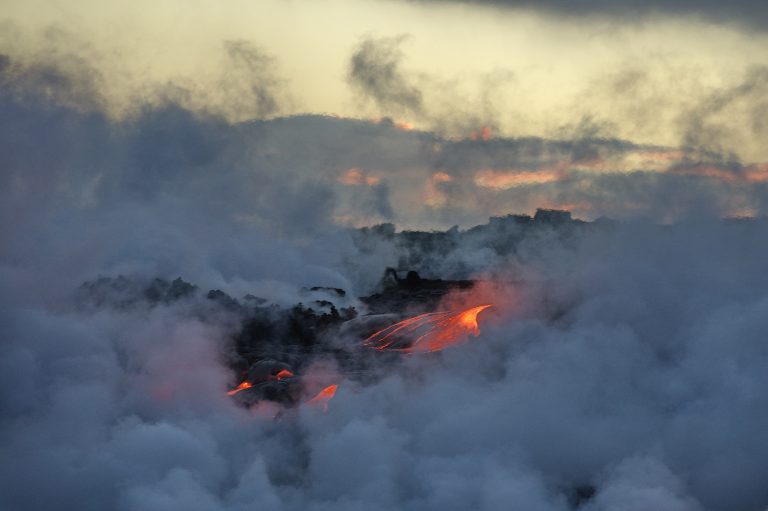 The hot lava of the Hawaiian volcano Kilauea flows into the wate