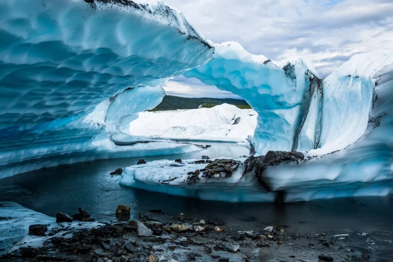 Two fins of ice seem to create an arch on the Matanuska Glacier cave in Alaska