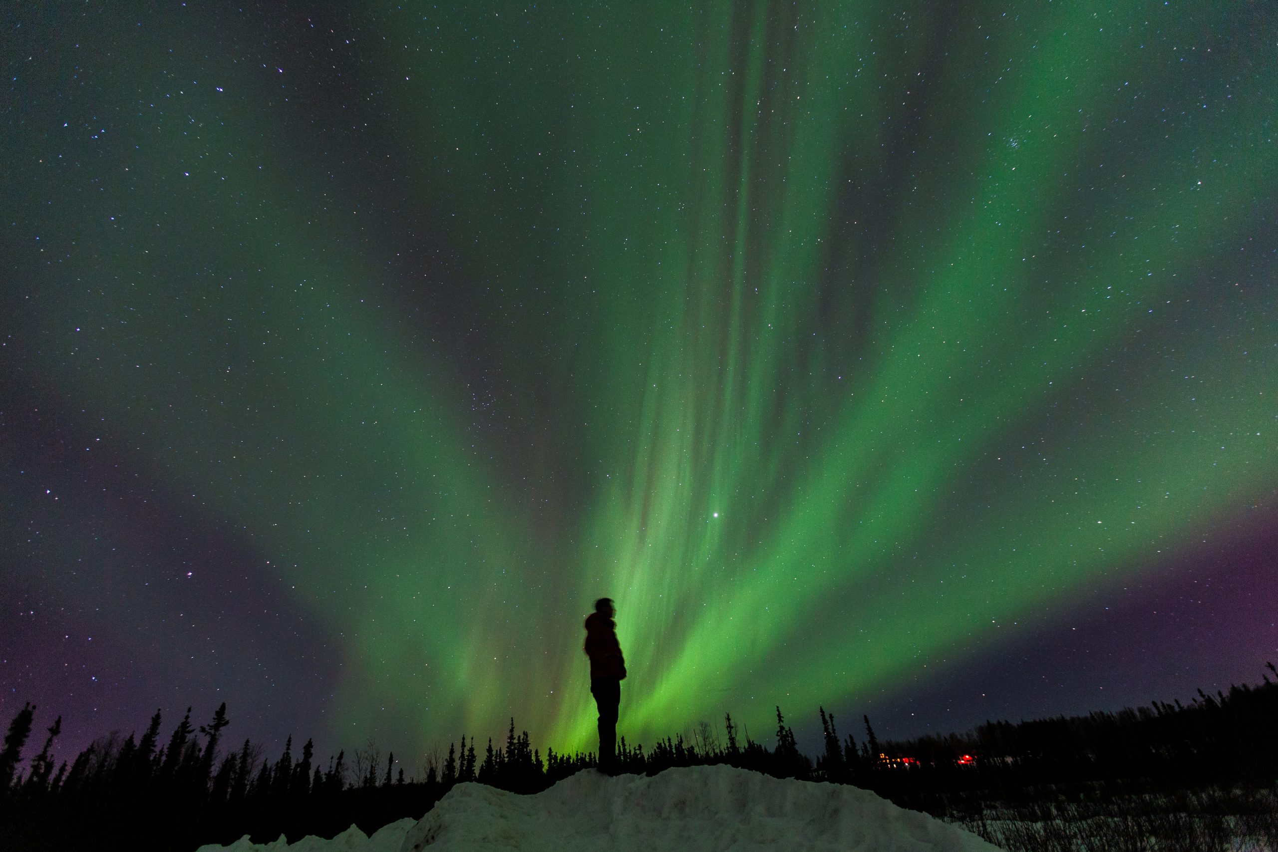 Silhouette man standing on the hill, Northern lights,  Fairbanks