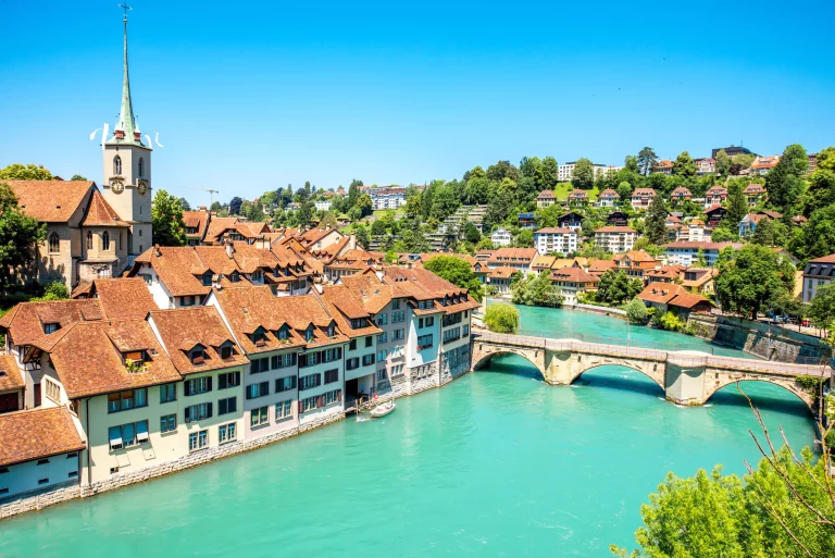 Cityscape view on the old town with Nydegg church tower and the river in Bern city in Switzerland