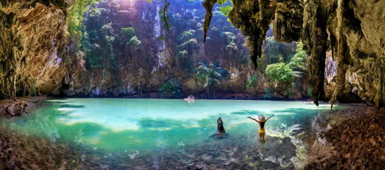 Panorama of Woman enjoying in princess lagoon at Railay, Krabi in Thailand