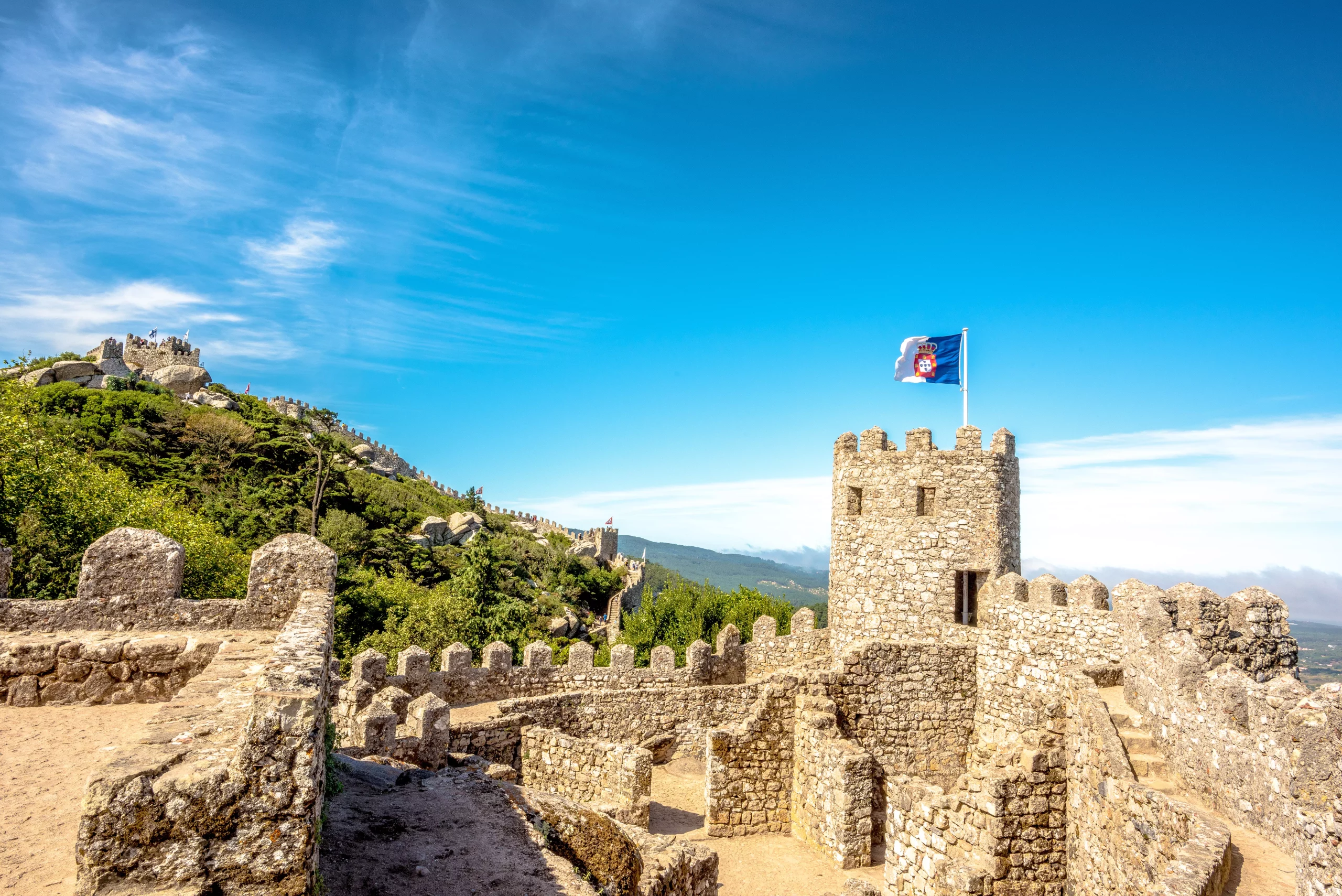 A fragment of the walls of a fortress with battle tower