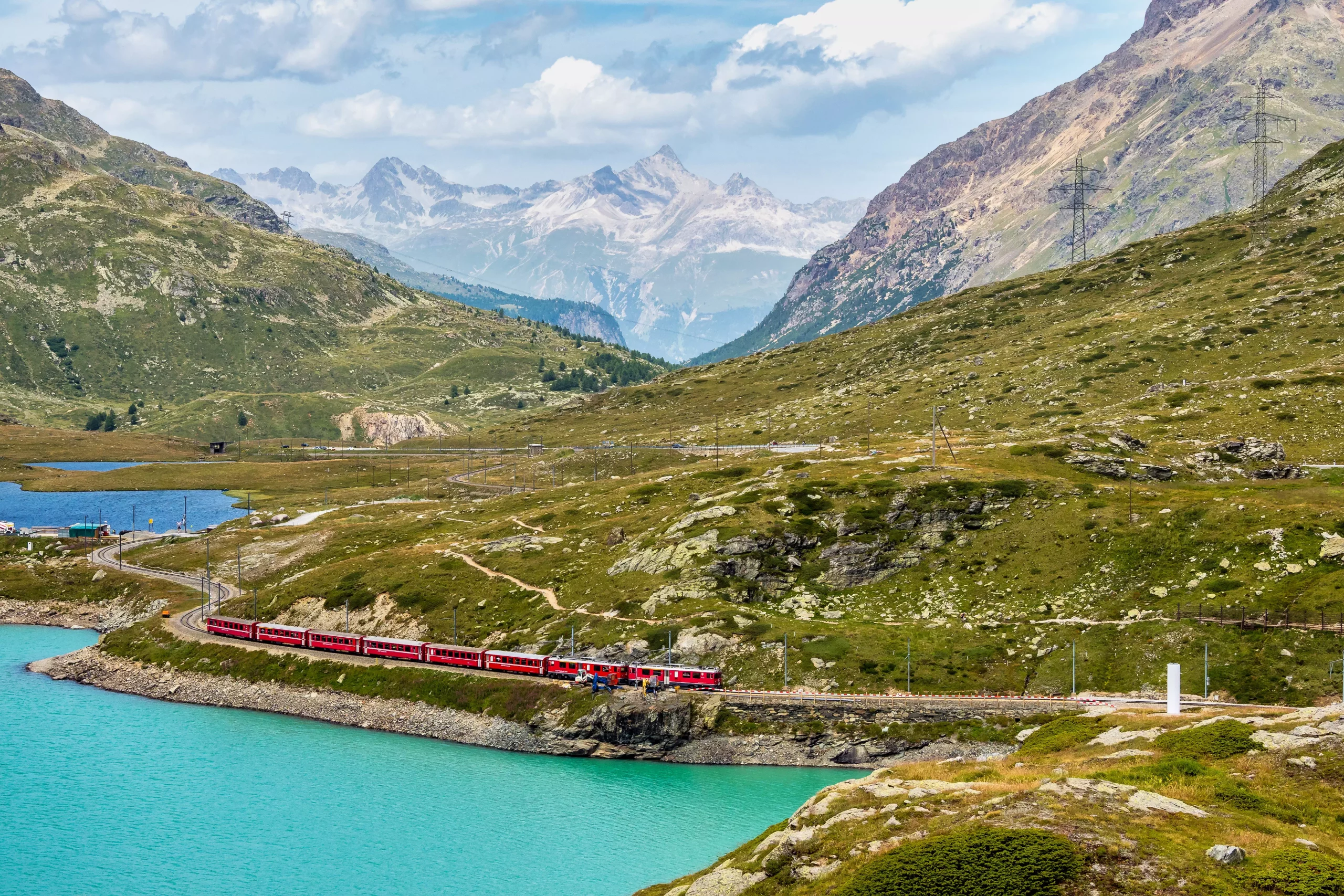 Bernina Express at the White Lake in Ospizio Bernina, Engadin, Switzerland