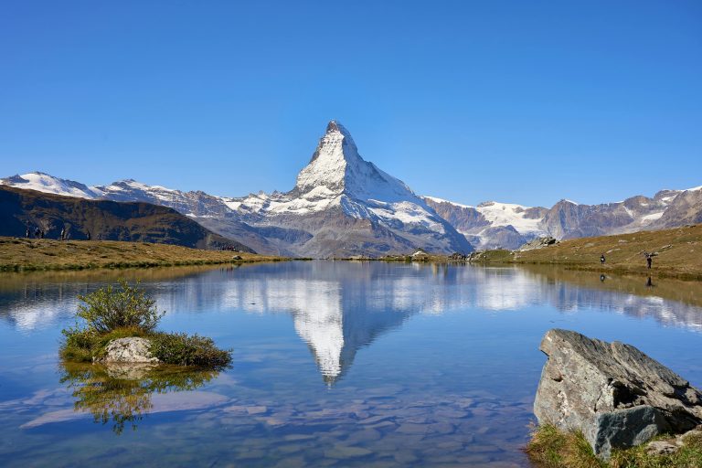 Breathtaking view of the Matterhorn reflected in a clear alpine lake in Zermatt, Switzerland