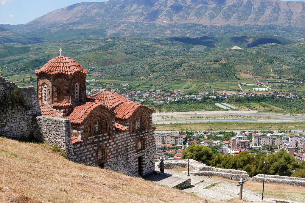 Stunning view of a church and landscape in Gjirokaster, Albania.